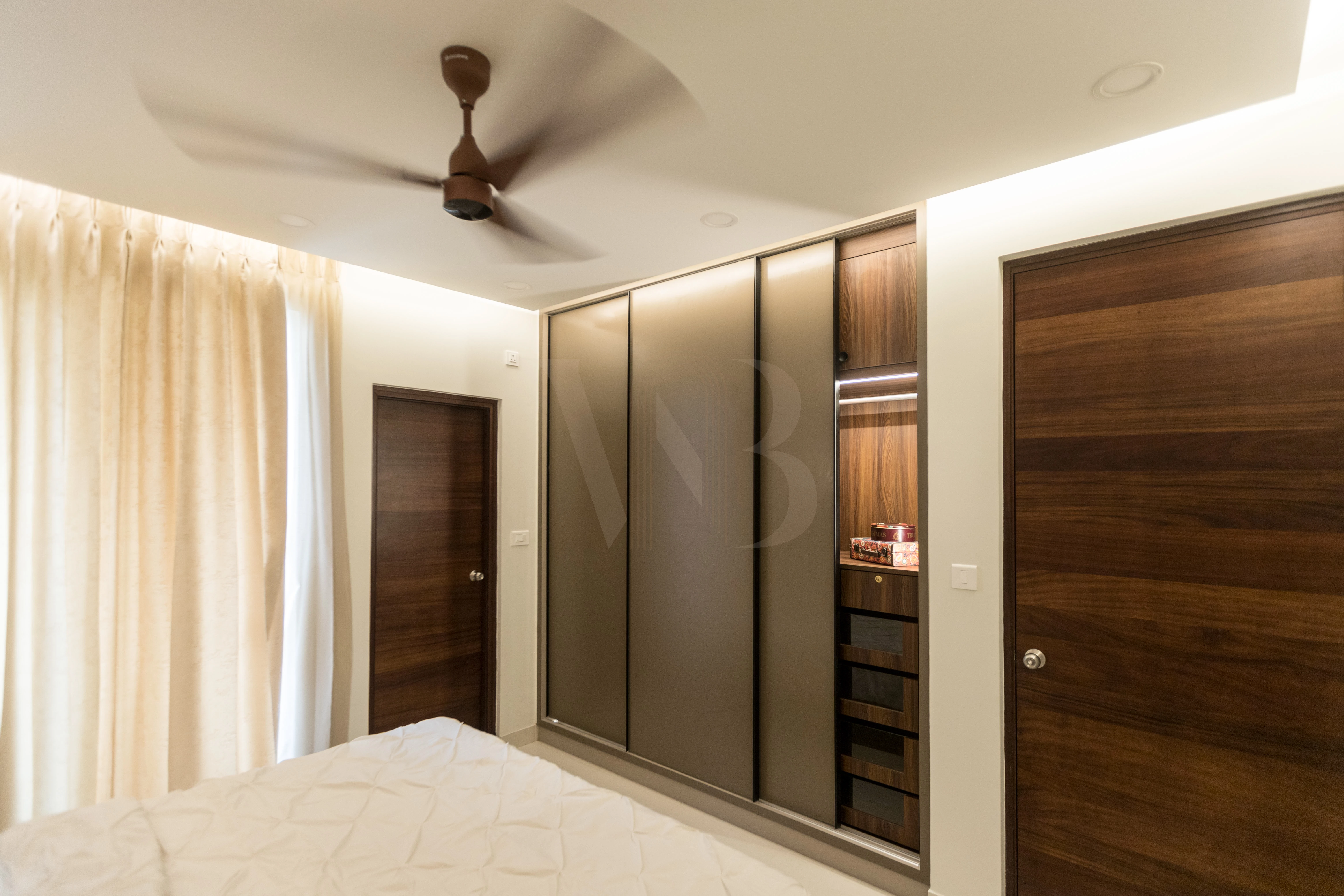 Master wardrobe with mirrored sliding shutters