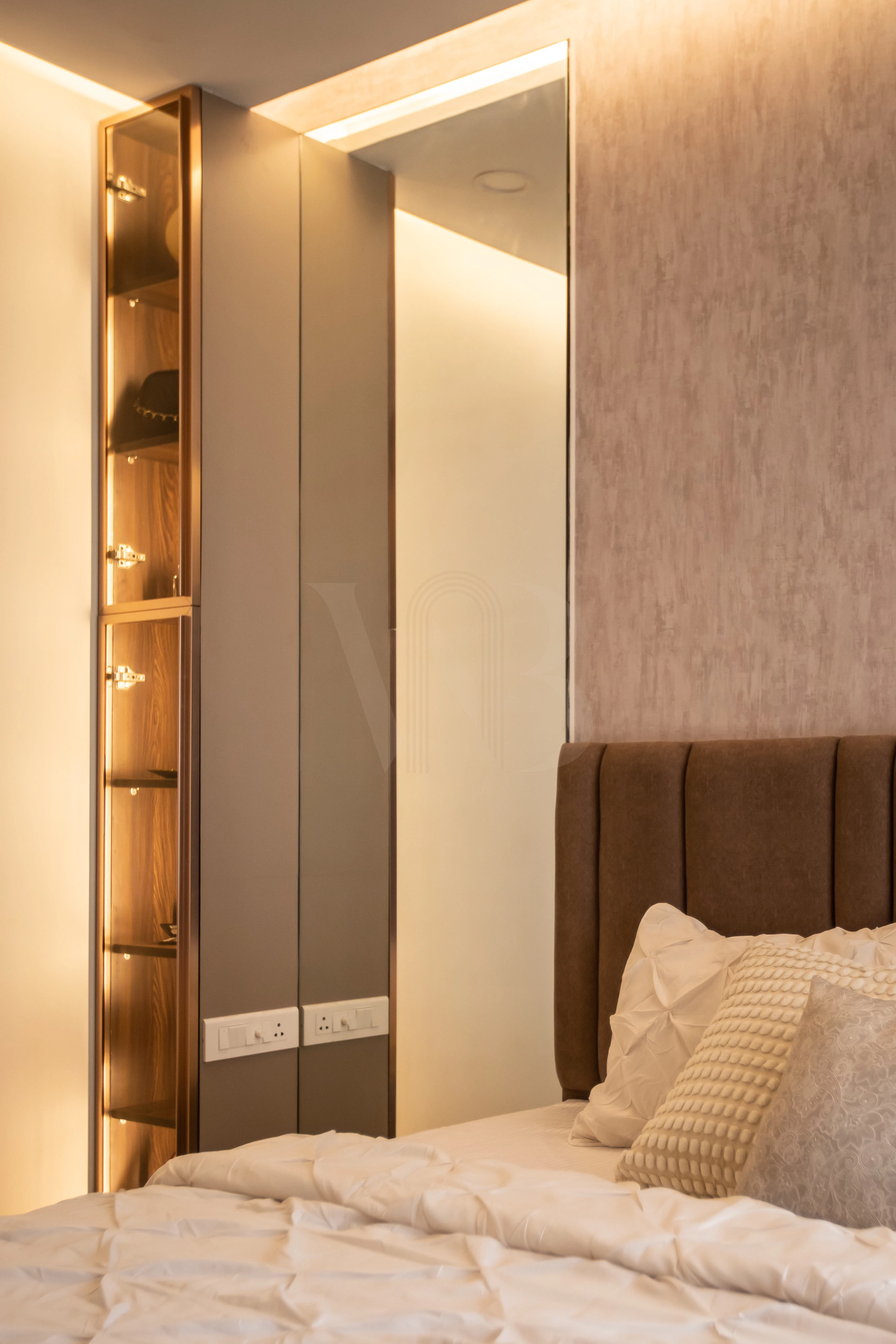 Minimalist bedside table styling and warm wood tones